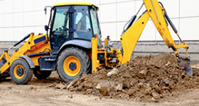 Excavator digging hole